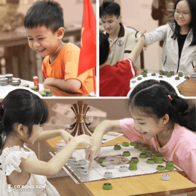 Nụ cười rạng rỡ và khoảnh khắc đập tay ăn mừng đầy thích thú của các bé khi tham gia sự kiện trải nghiệm Cờ Đông Sơn dịp cuối tuần.